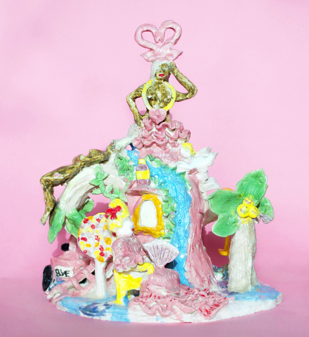 Yvette Mayorga’s porcelain sculpture sits in the center of a bright pink background.
